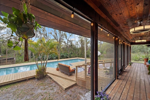 deck featuring an outdoor pool