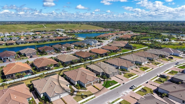 aerial view with a water view and a residential view