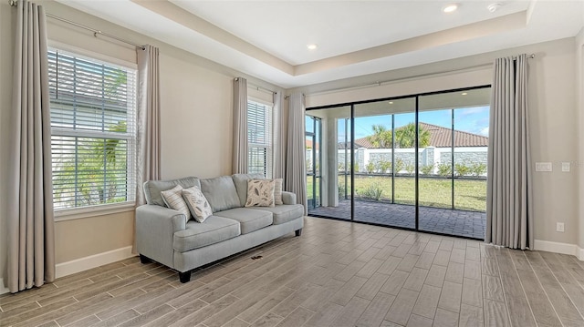 living room with wood tiled floor and baseboards