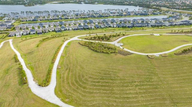 bird's eye view with a water view and a residential view