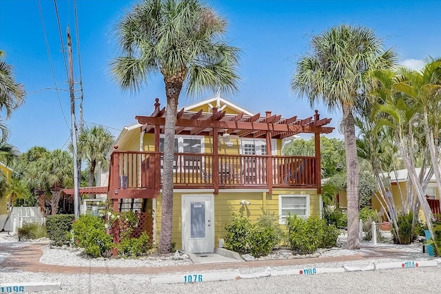 view of front of property with a pergola