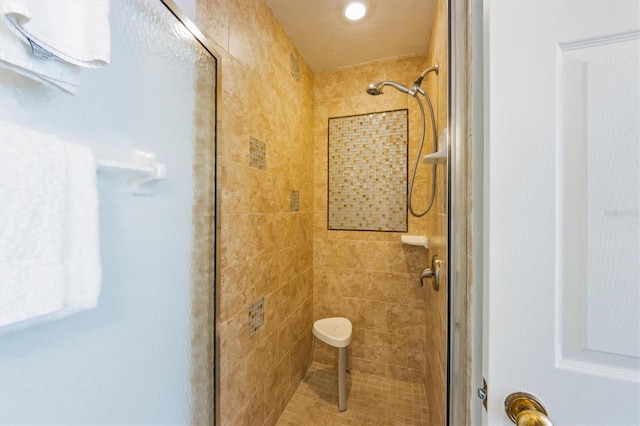 bathroom with a shower stall