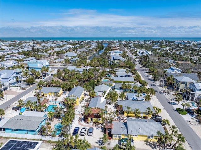 aerial view featuring a water view and a residential view