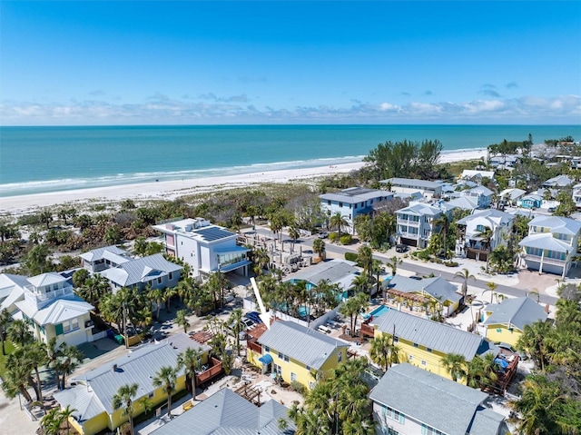 aerial view with a water view and a view of the beach