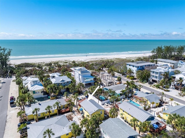 birds eye view of property with a view of the beach, a water view, and a residential view