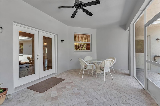 sunroom featuring french doors and ceiling fan