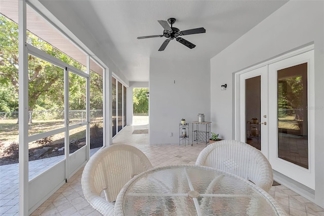 sunroom with french doors and ceiling fan