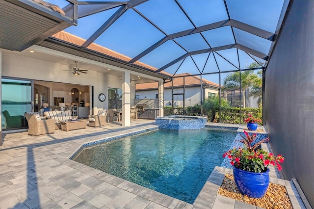 view of swimming pool with a pool with connected hot tub, area for grilling, a ceiling fan, a patio area, and an outdoor living space