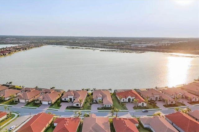 birds eye view of property featuring a water view and a residential view