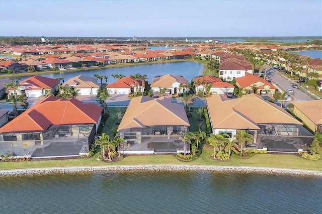 bird's eye view with a water view and a residential view