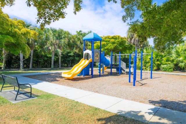 community jungle gym with a yard