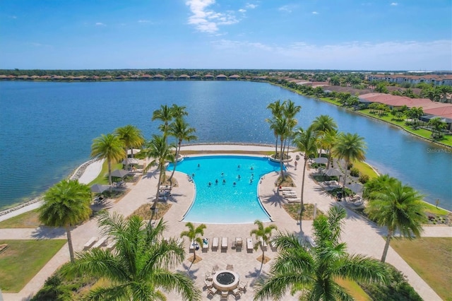 birds eye view of property with a water view