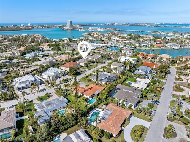 bird's eye view with a residential view and a water view