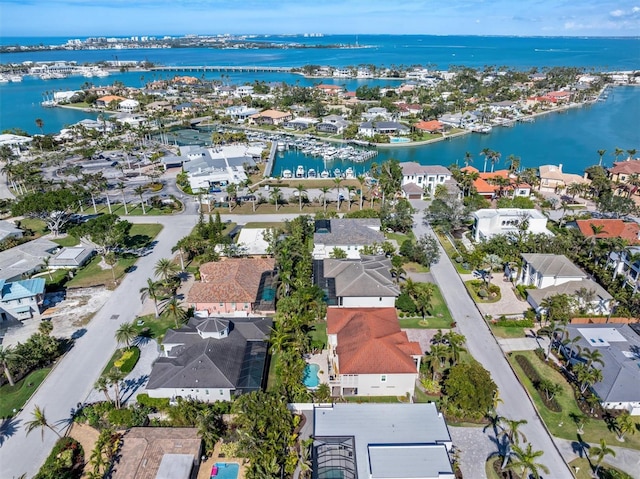 aerial view with a residential view and a water view