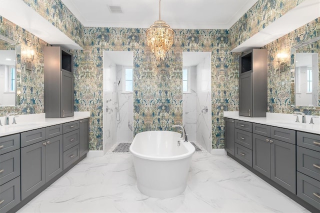 bathroom with marble finish floor, a marble finish shower, visible vents, and a sink