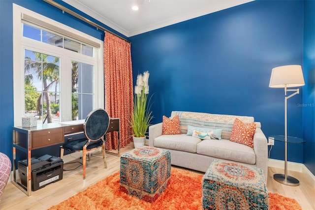 living area with recessed lighting, crown molding, baseboards, and wood finished floors