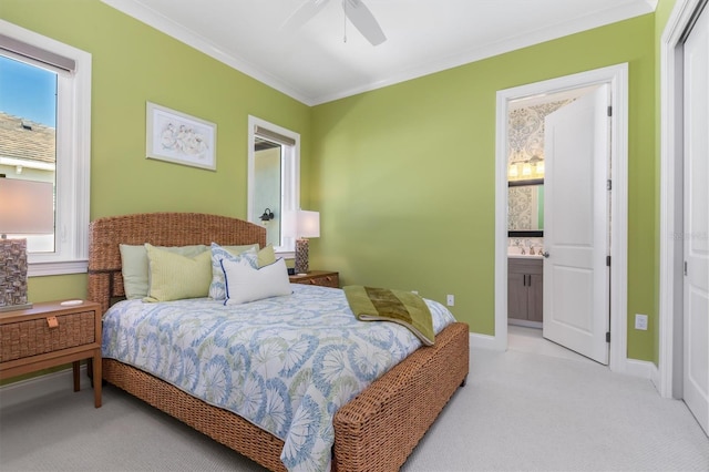 bedroom with light carpet, ornamental molding, multiple windows, and connected bathroom