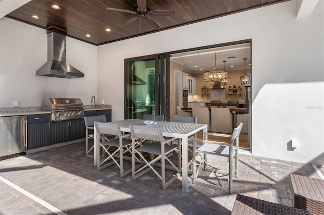 view of patio featuring outdoor dining space, ceiling fan, and area for grilling