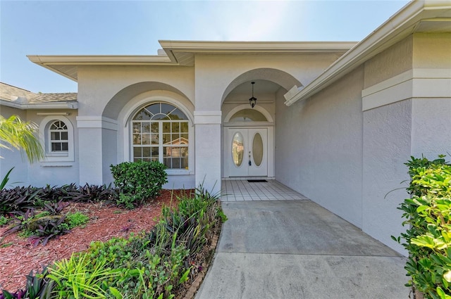 property entrance featuring stucco siding