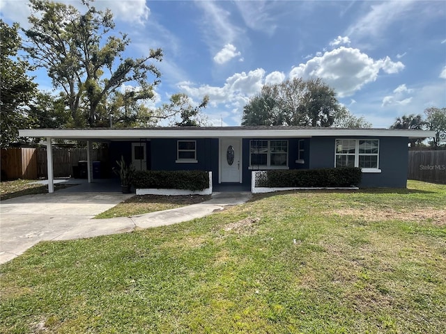 single story home with an attached carport, driveway, a front lawn, and fence