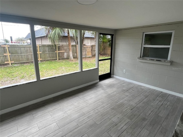 unfurnished sunroom with a healthy amount of sunlight