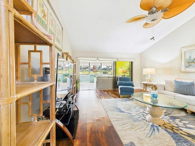 living room featuring ceiling fan, high vaulted ceiling, and wood finished floors