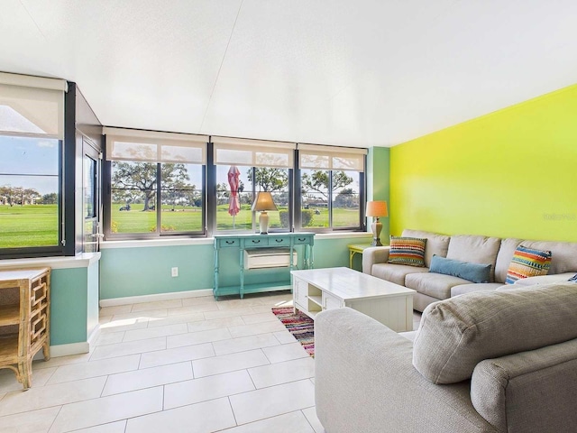 living room featuring tile patterned flooring and baseboards