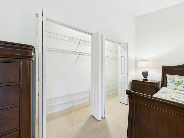 bedroom featuring light colored carpet