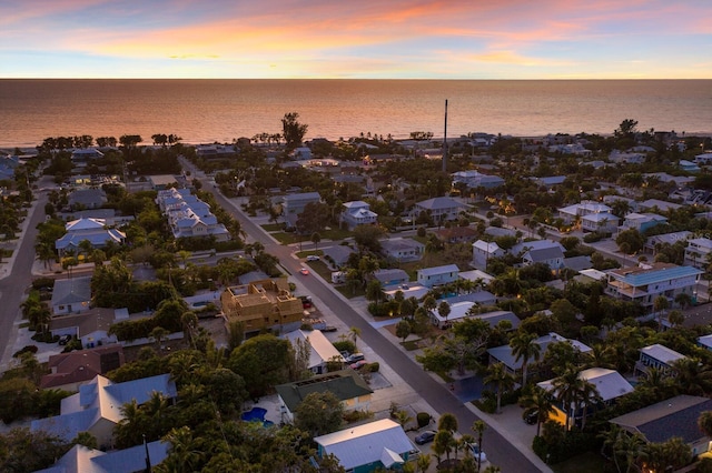 bird's eye view featuring a water view and a residential view