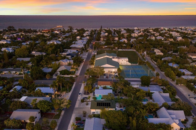 aerial view at dusk with a water view