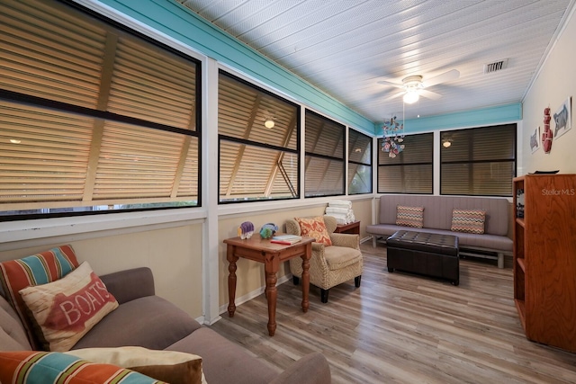 sunroom / solarium with visible vents and ceiling fan