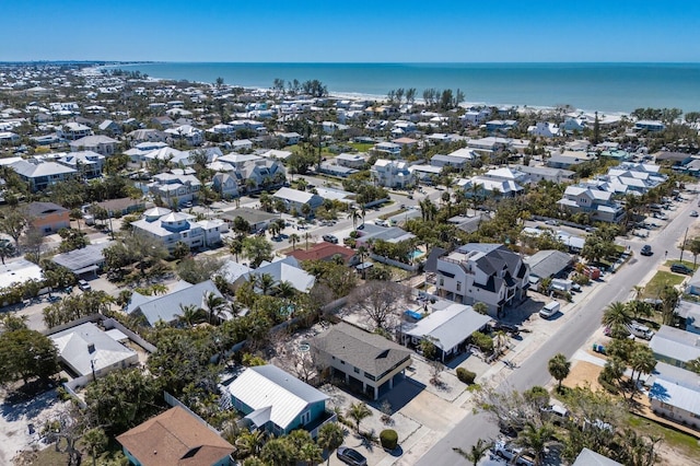 birds eye view of property featuring a water view and a residential view