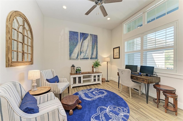 office space featuring recessed lighting, wood finished floors, a ceiling fan, and baseboards