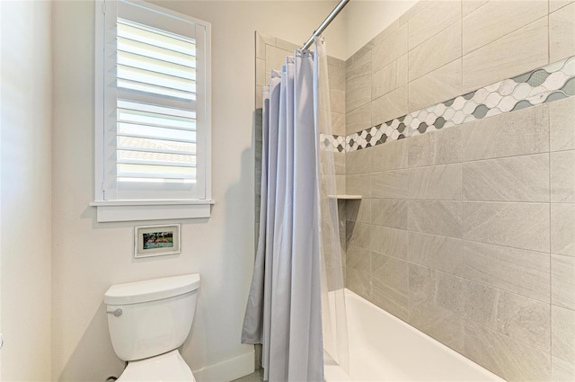 full bathroom featuring shower / bath combo and toilet