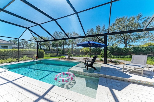 view of swimming pool with a lanai, fence, a fenced in pool, and a patio