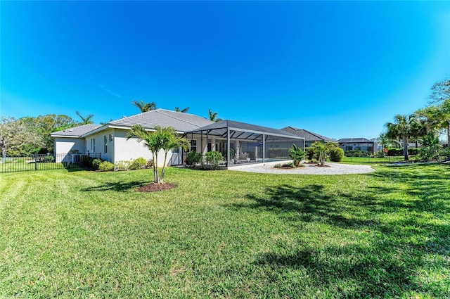 exterior space featuring a lanai and fence