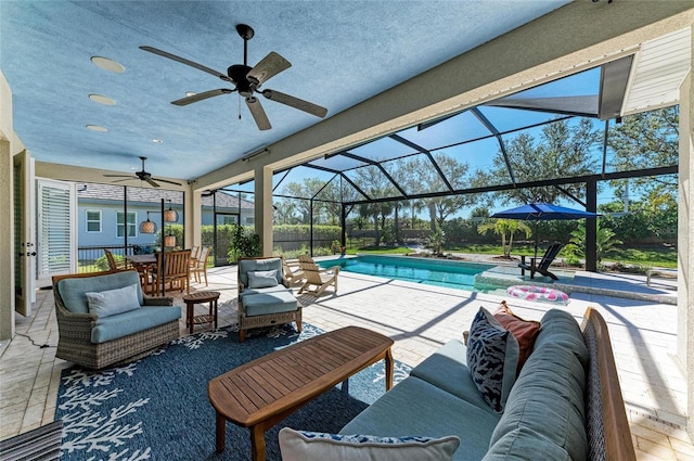 outdoor pool featuring glass enclosure, ceiling fan, an outdoor hangout area, a patio area, and outdoor dining space