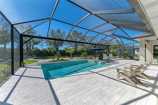 view of pool with a patio, a lanai, and a pool with connected hot tub