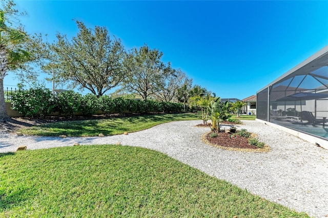 view of yard with a lanai