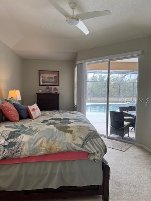 carpeted bedroom with a ceiling fan, access to outside, and baseboards