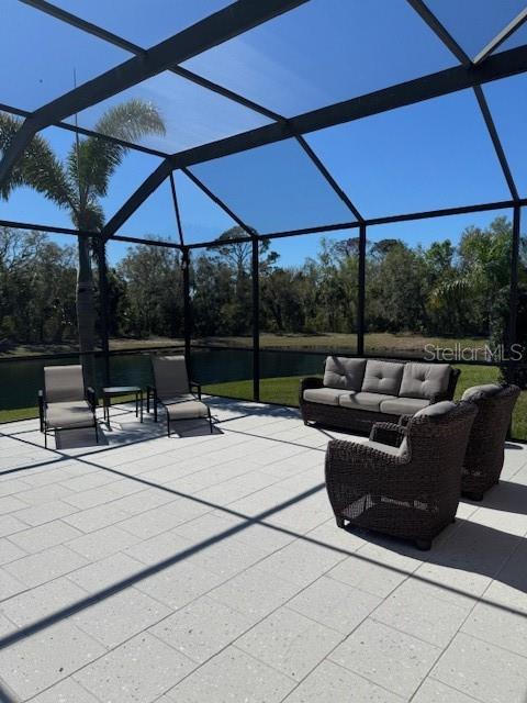 view of patio with a lanai and an outdoor living space