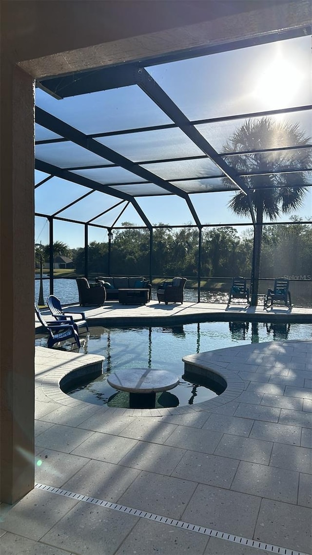 pool with a patio area and a lanai