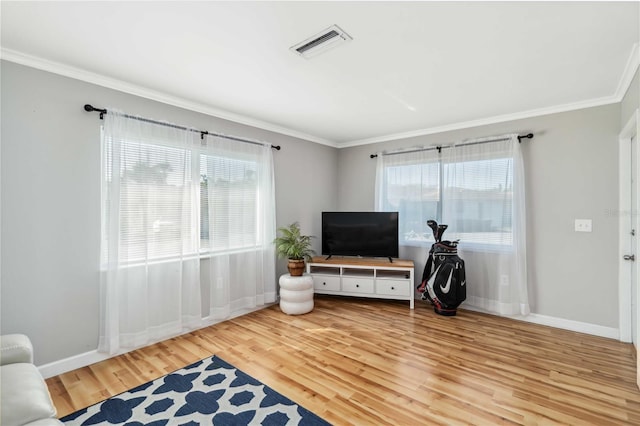 living room with visible vents, plenty of natural light, and wood finished floors