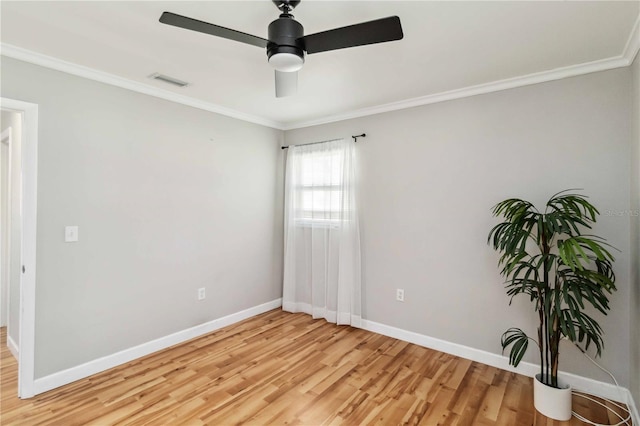 unfurnished room featuring visible vents, baseboards, light wood-type flooring, ornamental molding, and a ceiling fan