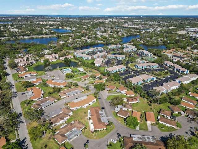 bird's eye view featuring a residential view and a water view