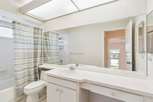 full bathroom featuring vanity, toilet, and shower / bath combo with shower curtain