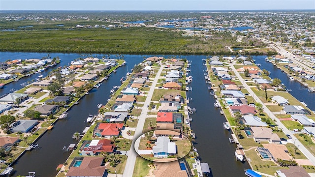 bird's eye view with a residential view and a water view