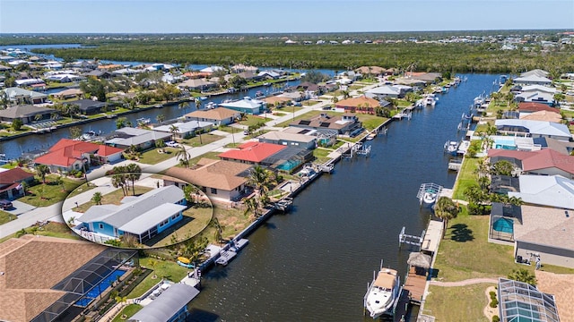 drone / aerial view with a residential view and a water view