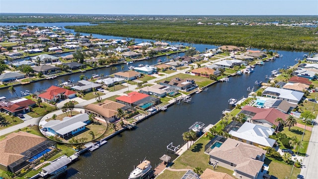 drone / aerial view with a residential view and a water view