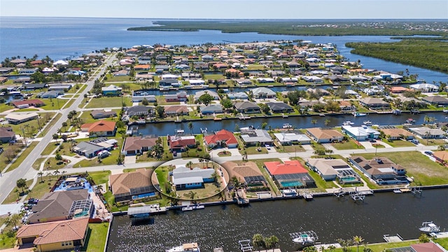 bird's eye view featuring a residential view and a water view